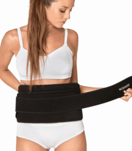 Girl wrapping neoprene belt around her waist