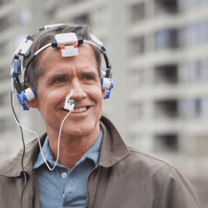 Man wearing headset and intranasal device