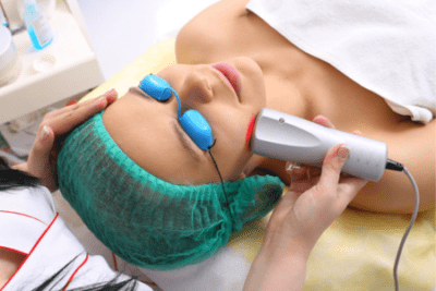 Woman getting red light therapy on the face